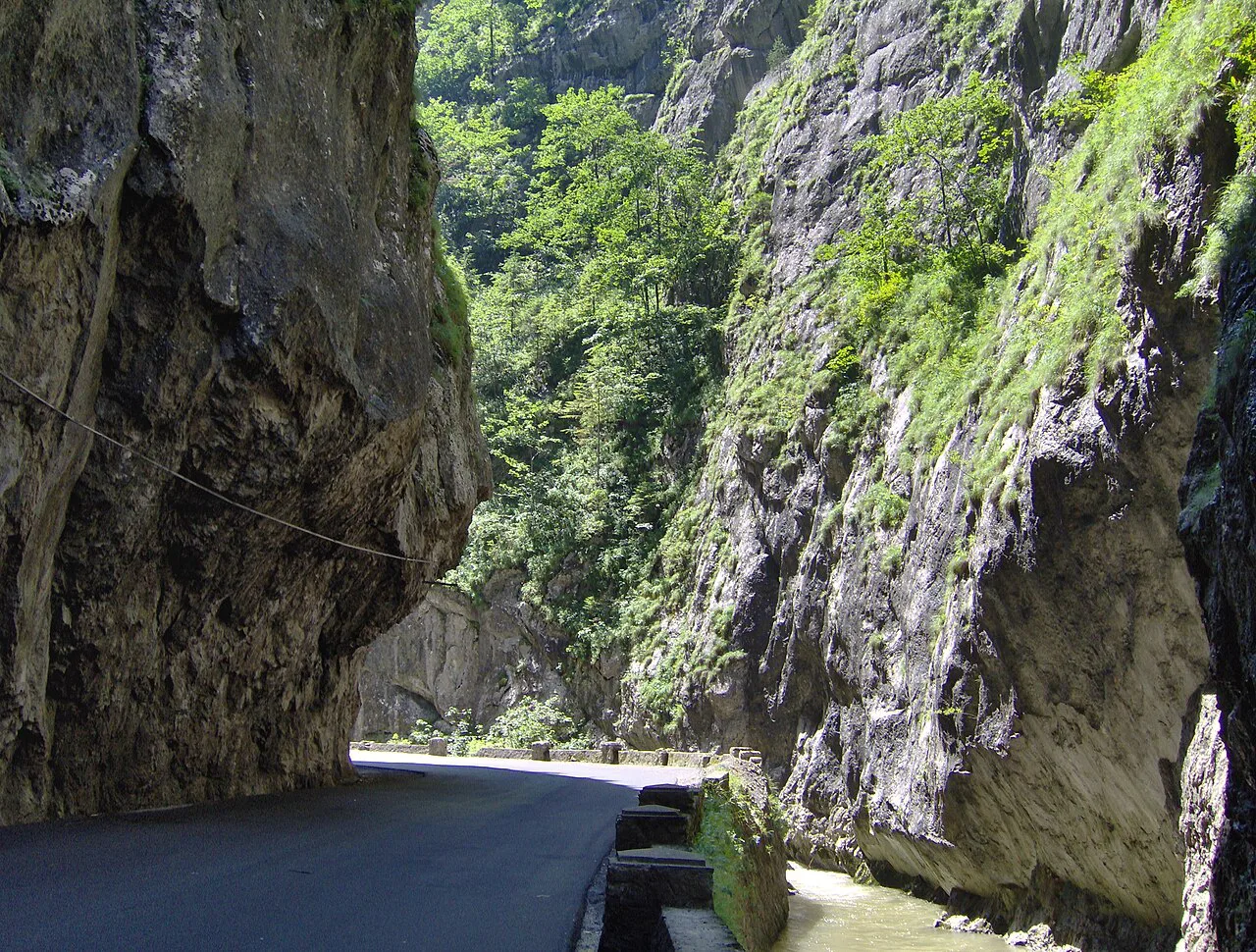 Road squeezed beneath an overhanging cliff in the Bicaz Gorge.