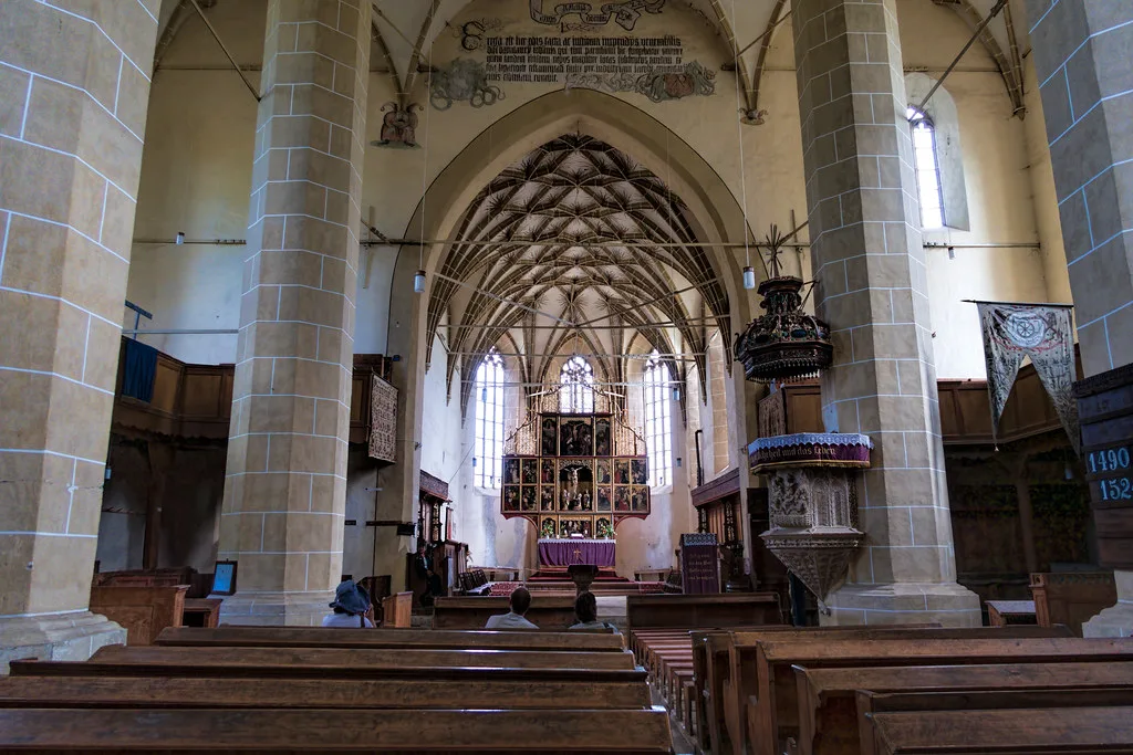 The nave and altarpiece inside Biertan's fortified church.