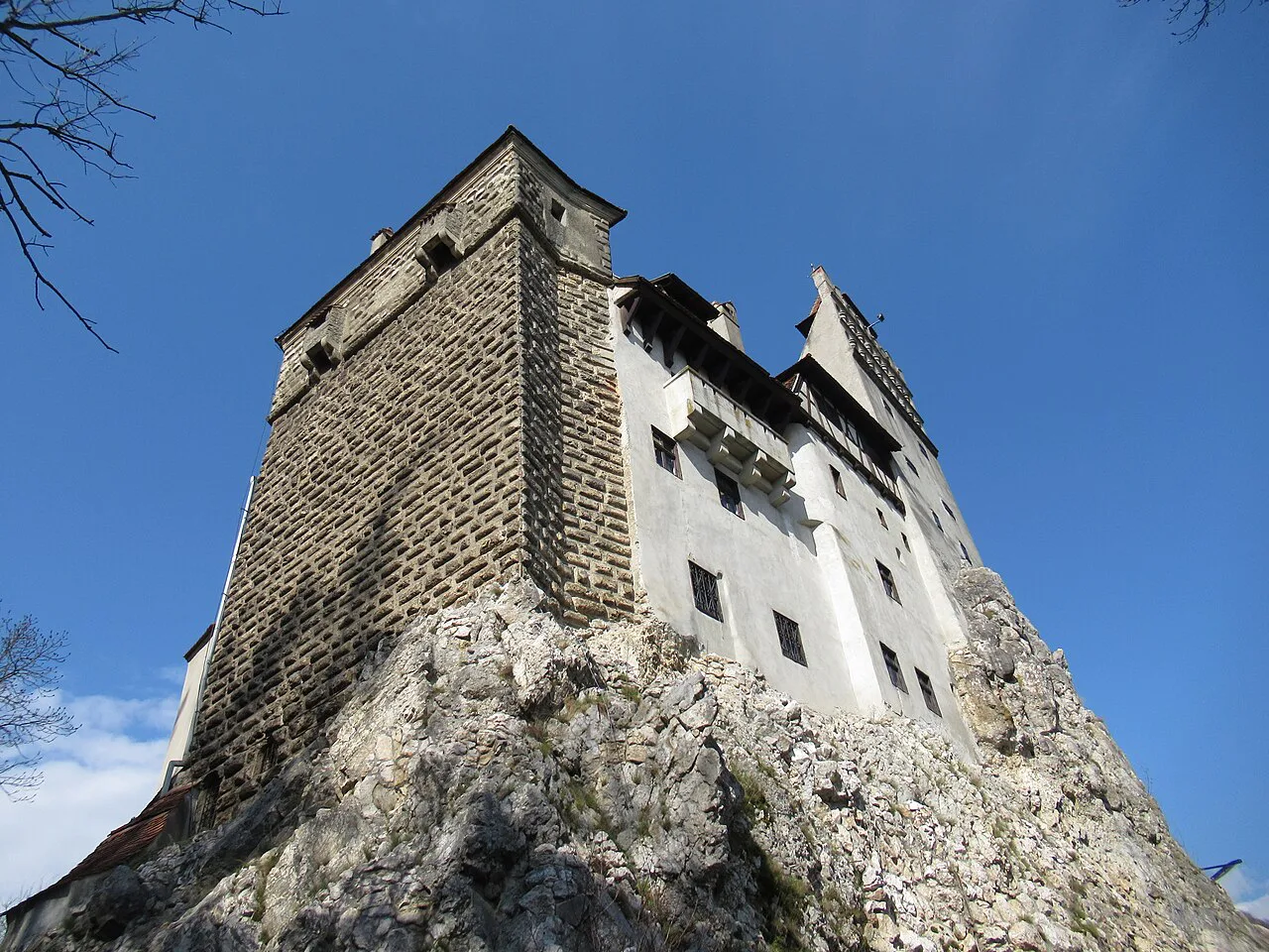 Bran Castle's tower rising from its rock.