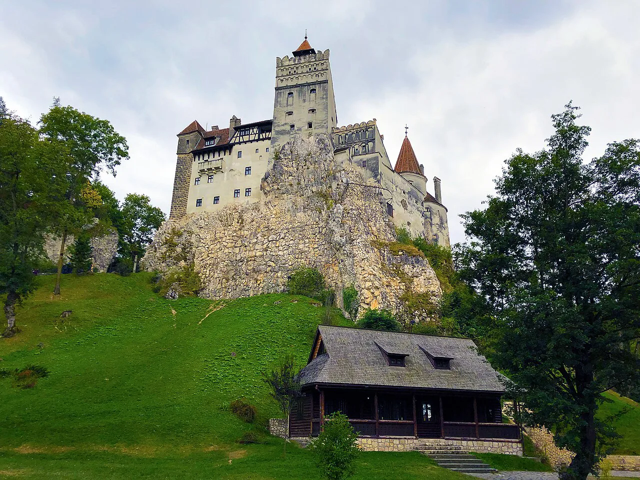 Bran Castle above its grassy hillside.
