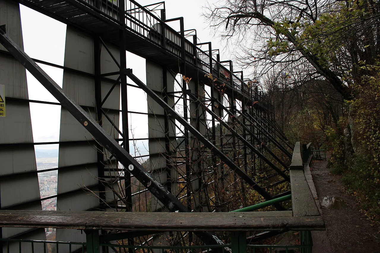 Steel framework behind the Brașov sign on Tâmpa Mountain.