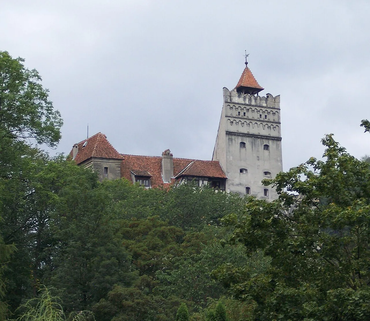 Bran Castle above the trees, near Brașov.
