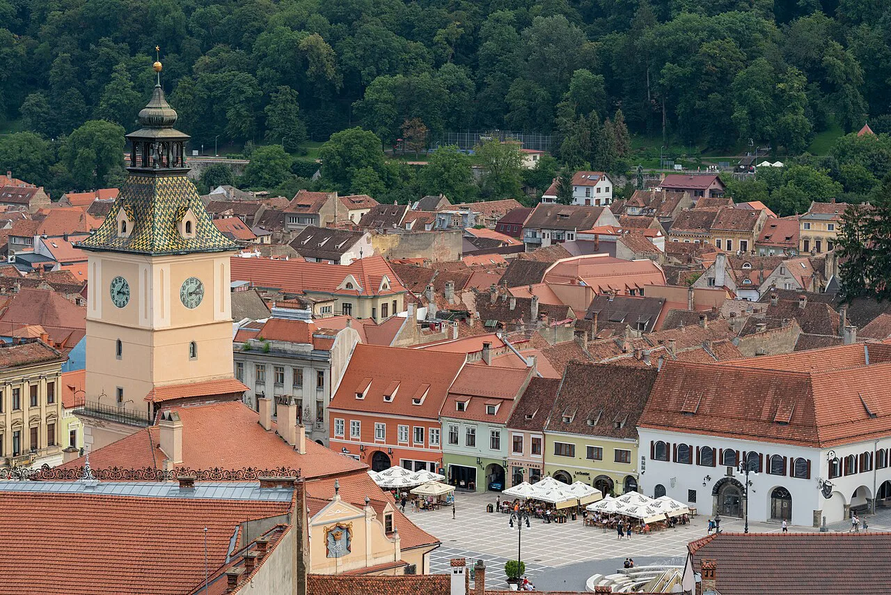 The Council House and Piața Sfatului seen over the rooftops of Brașov.