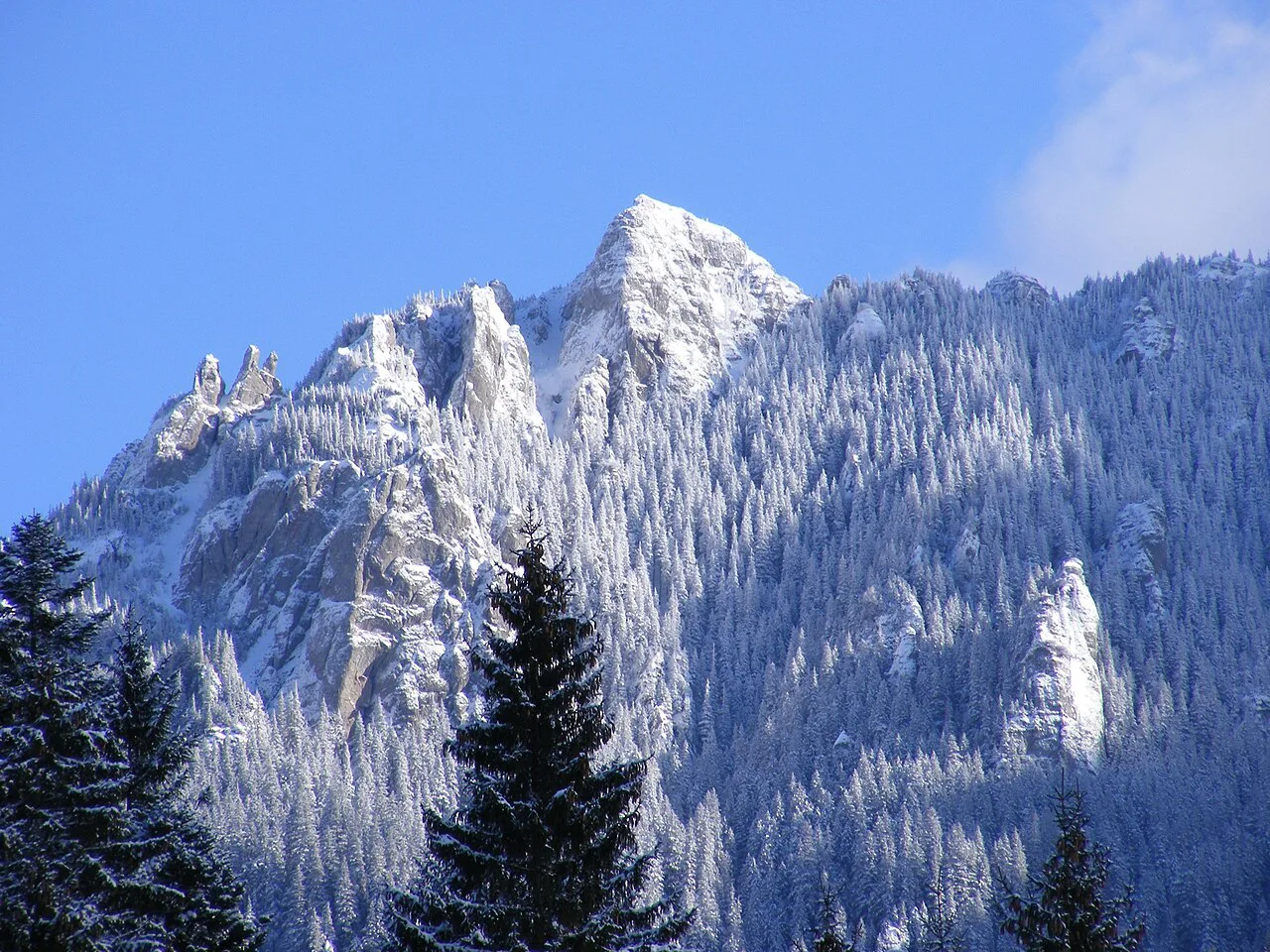 Snow-covered crest of the Ceahlău Massif.