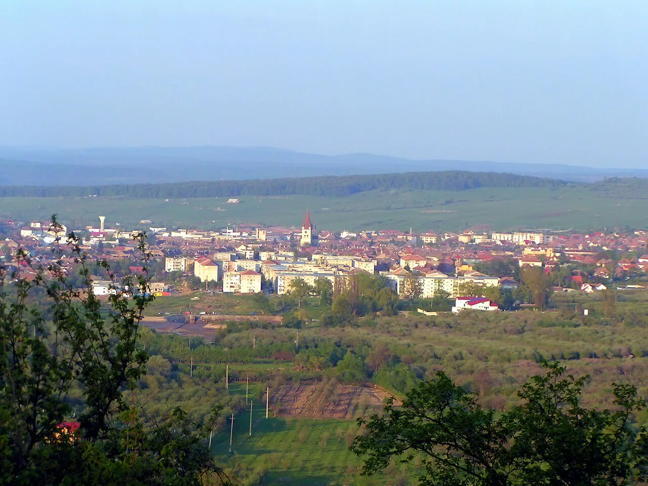 Cisnădie seen across the fields from the surrounding hills.