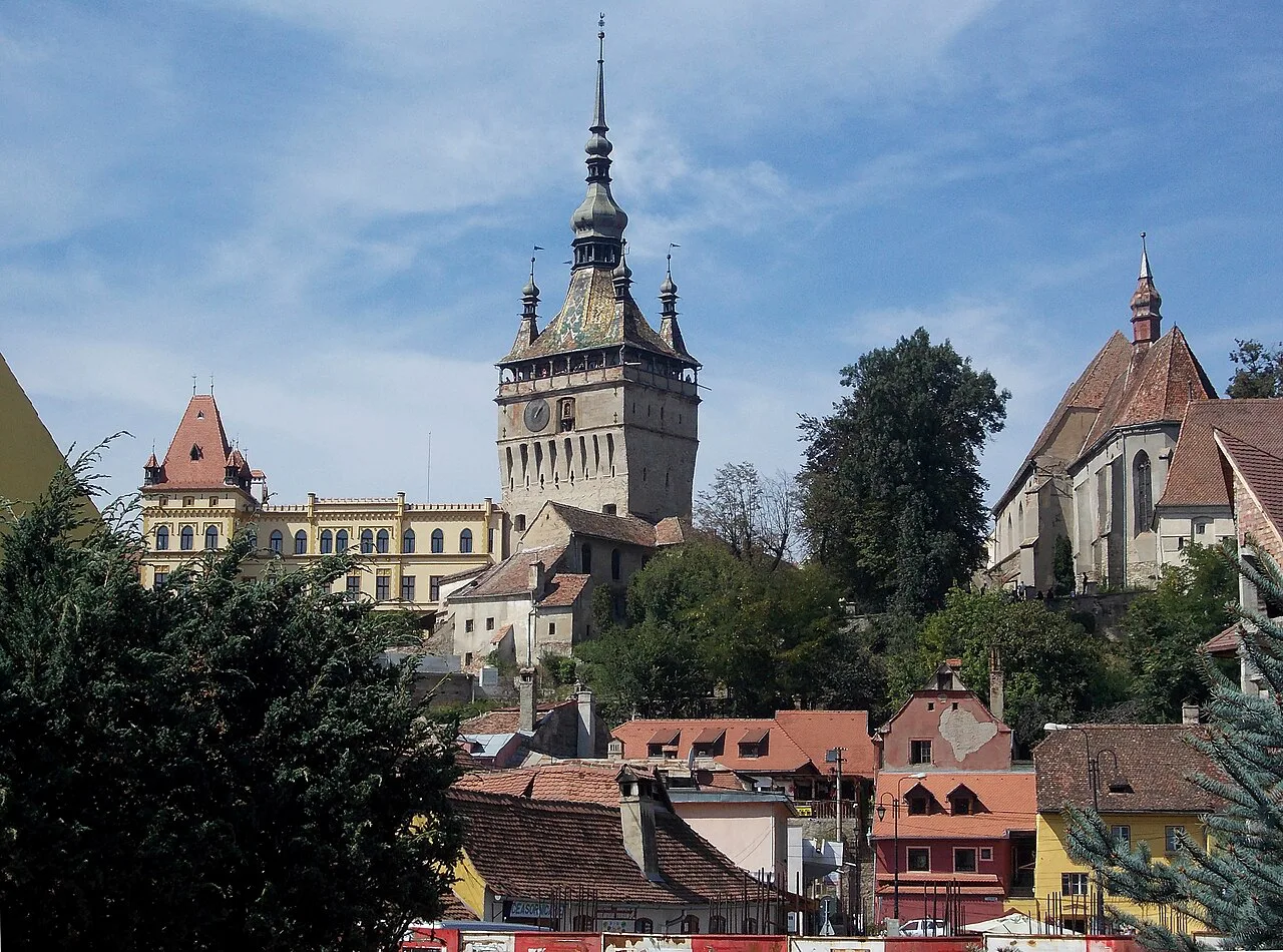 The Clock Tower above the rooftops of Sighișoara.