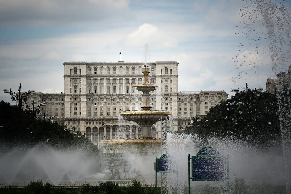 The Palace of the Parliament seen past the fountains of Piața Unirii, Bucharest.