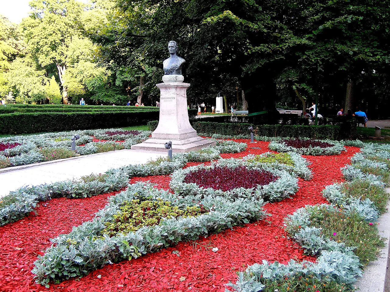 Mihai Eminescu's bust and flower beds in Copou Park, Iași.