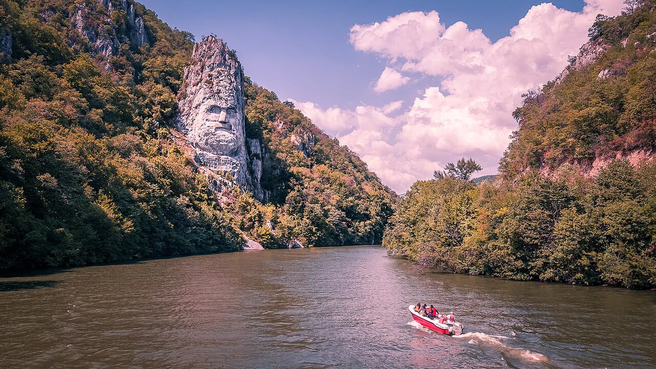 The Rock Sculpture of Decebalus with a speedboat on the Danube.
