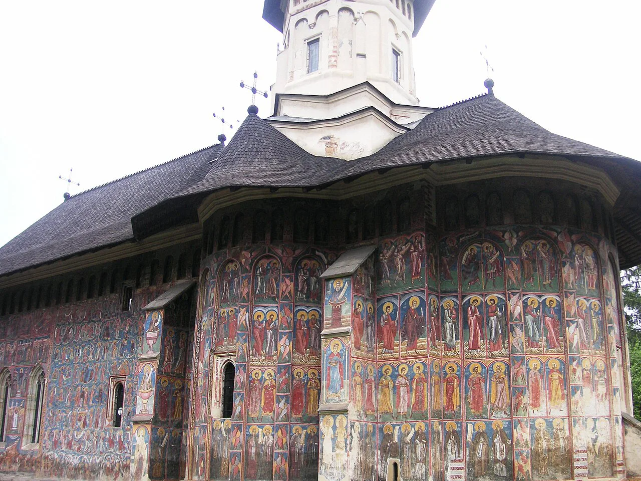 Painted exterior walls of the church at Moldovița Monastery.