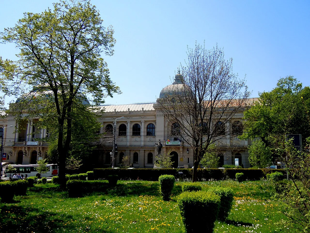 Main building of Alexandru Ioan Cuza University, Iași, behind its gardens.