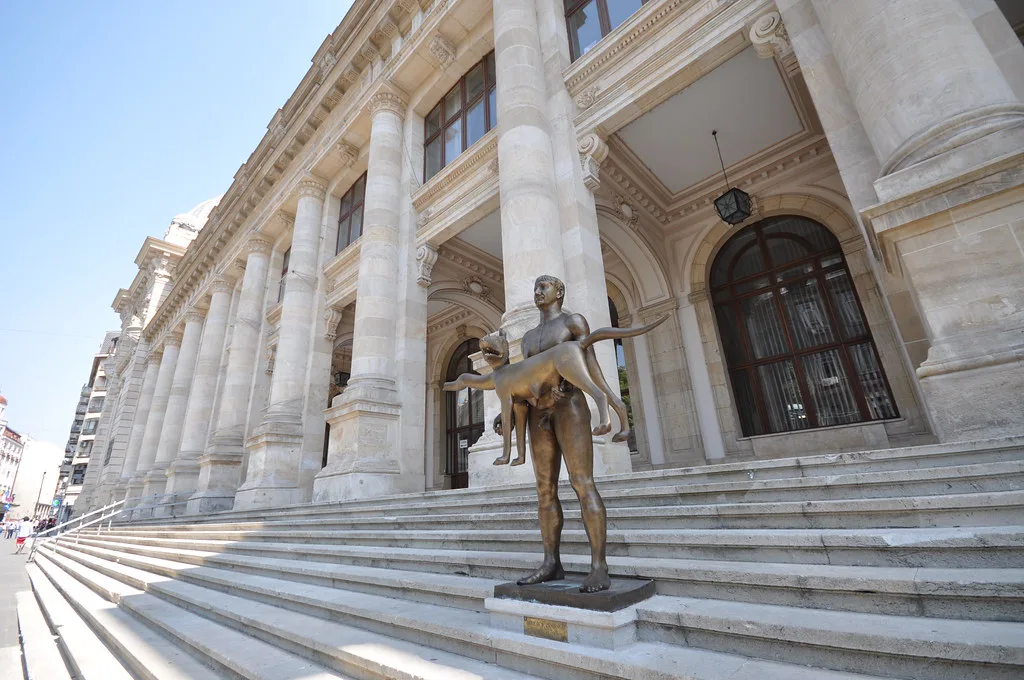 The National Museum of Romanian History and its Trajan statue in Bucharest.