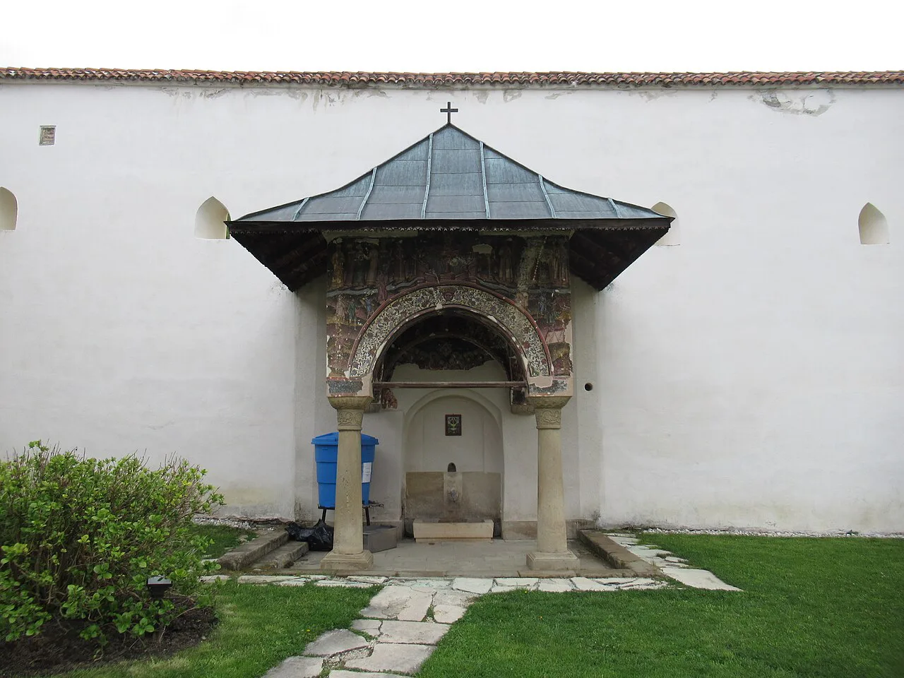 Carved stone fountain pavilion at Horezu Monastery.