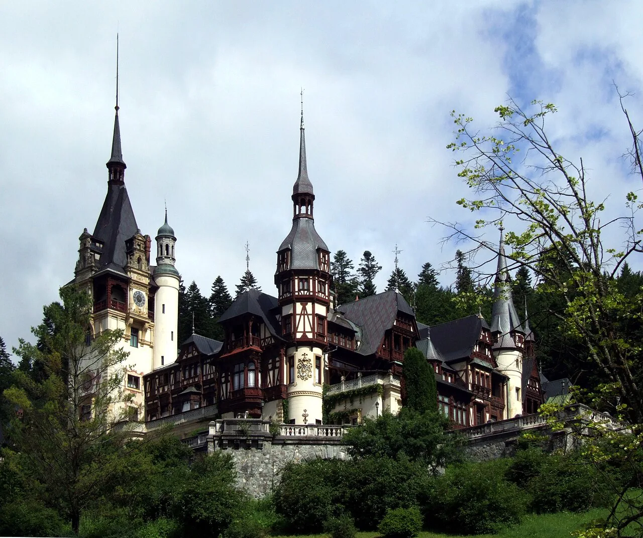 Peleș Castle in Sinaia among the forest.