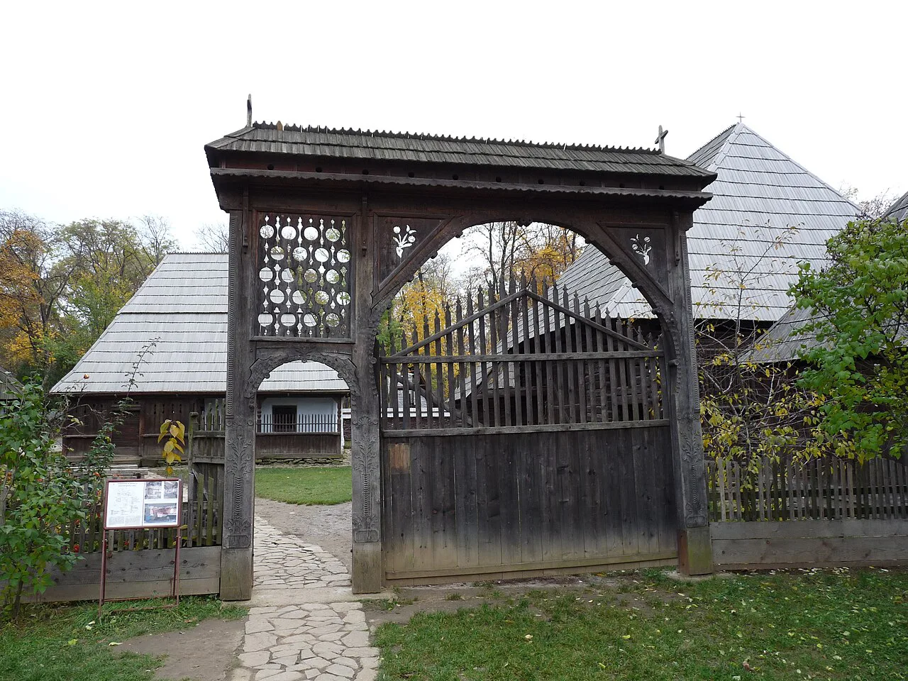 Carved Székely gate of the Bancu household at the Village Museum in Bucharest.