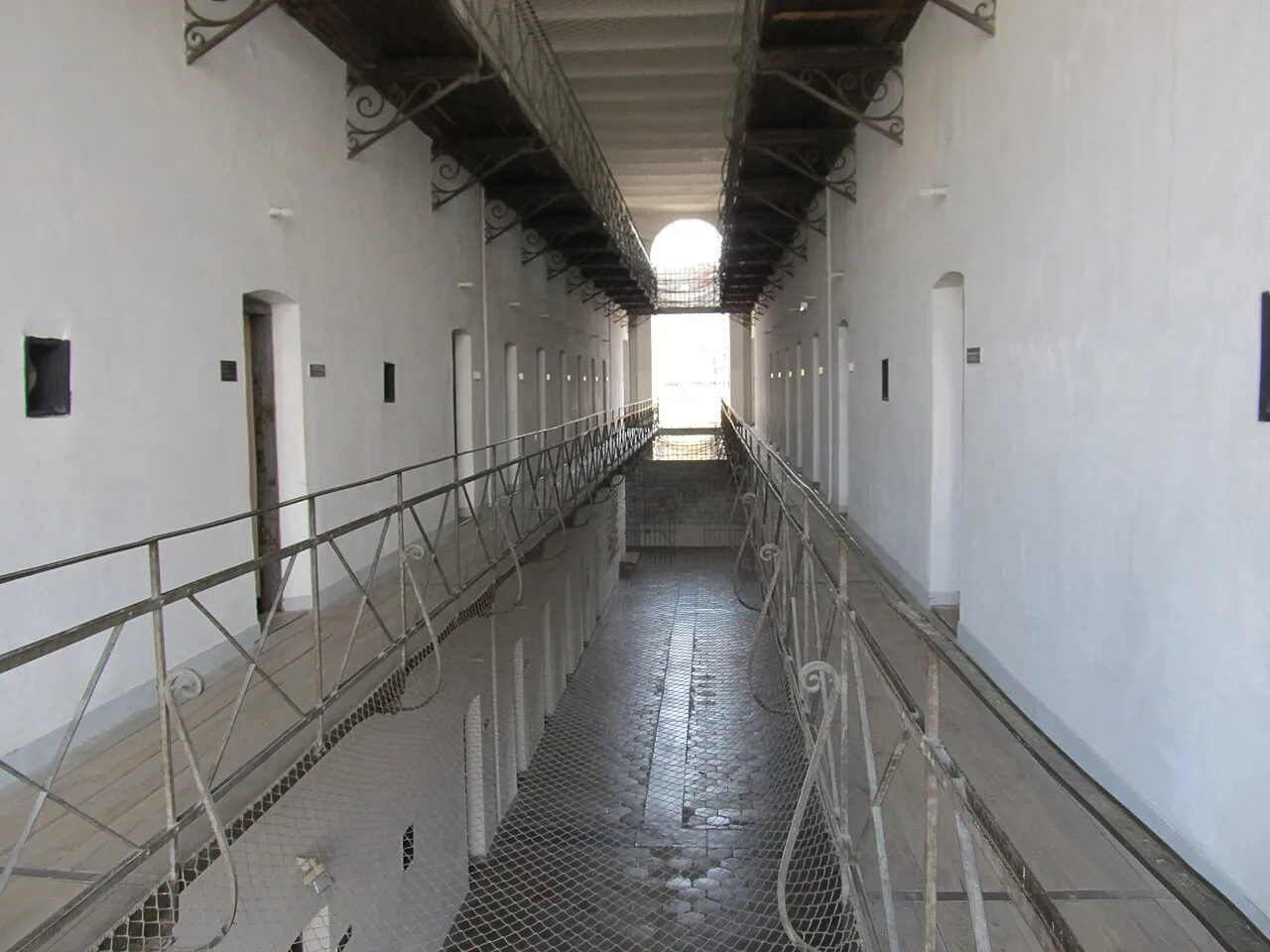 Cell-block corridor of the former prison at the Sighet Memorial to the Victims of Communism and of the Resistance.