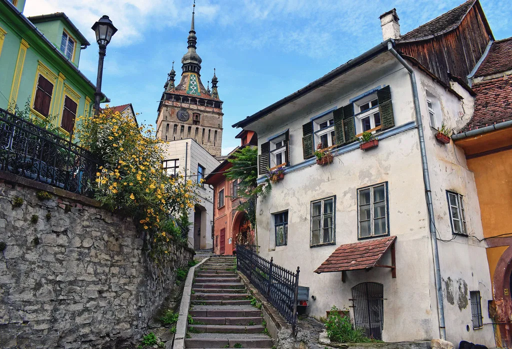 The Clock Tower above a stepped lane in Sighișoara.