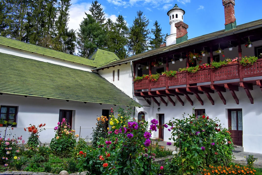 Monastery buildings and flower beds at Sinaia Monastery.
