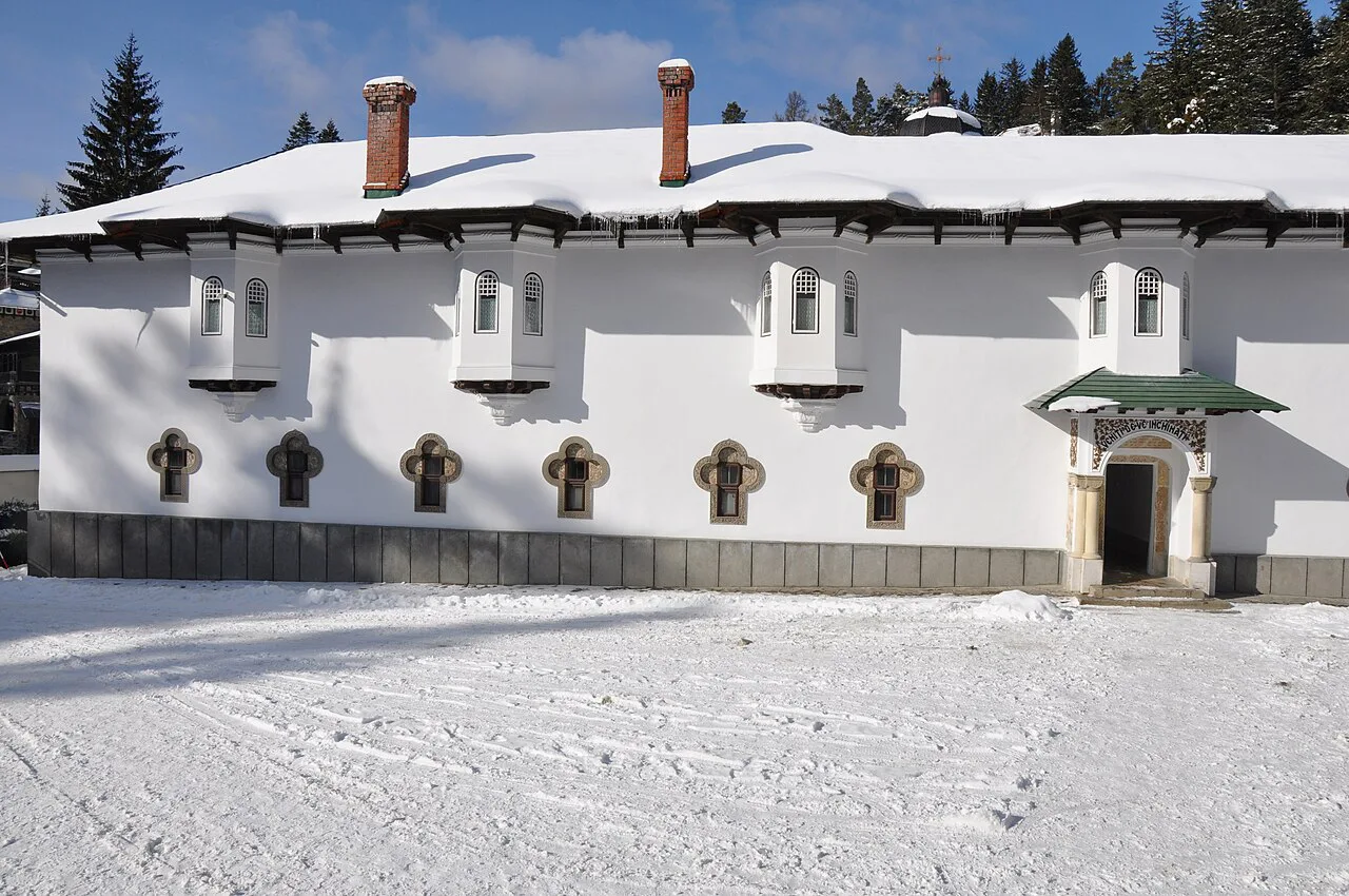 A snow-covered building at Sinaia Monastery.