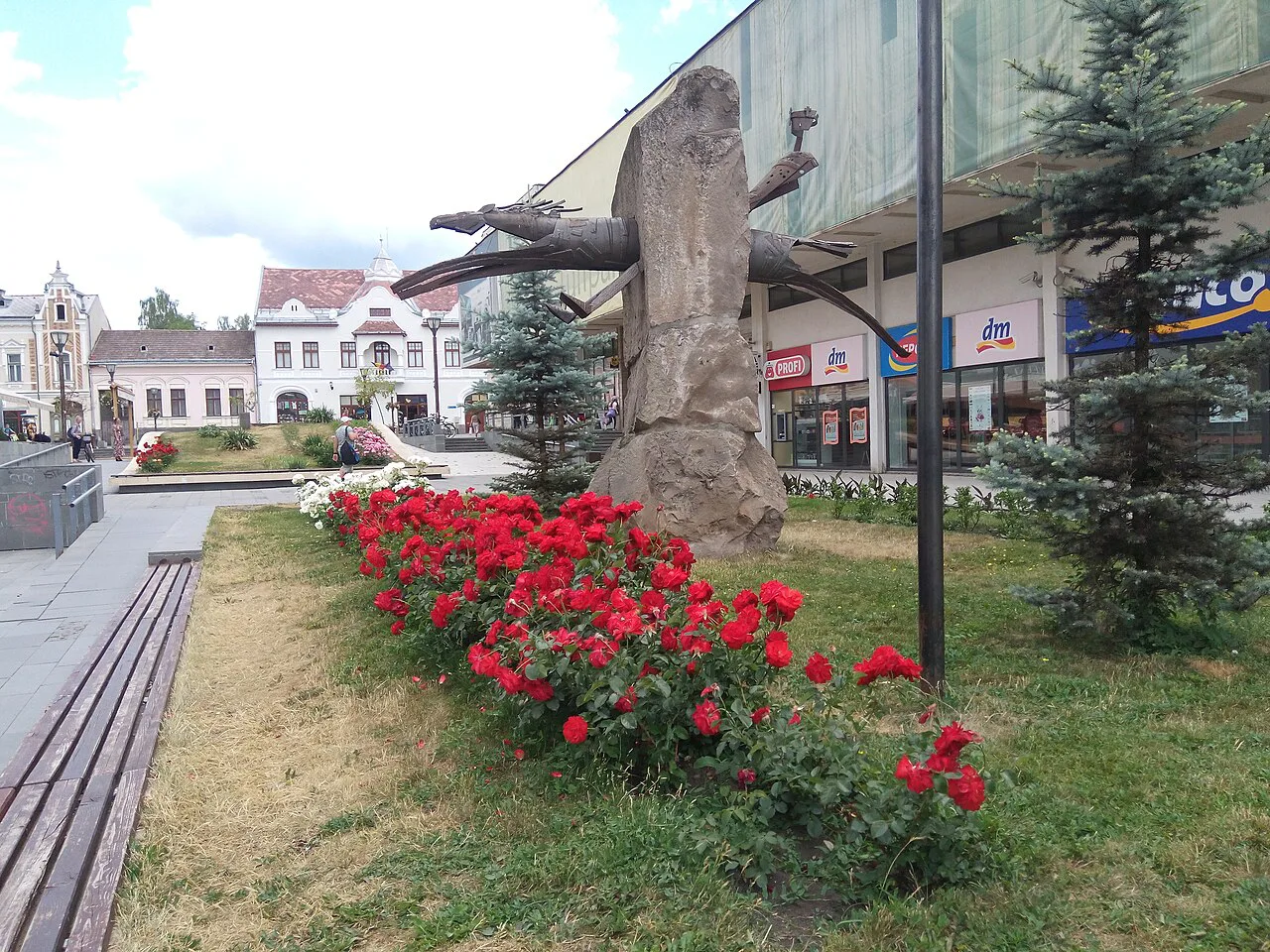 Flower beds and a carved sculpture in central Miercurea Ciuc.